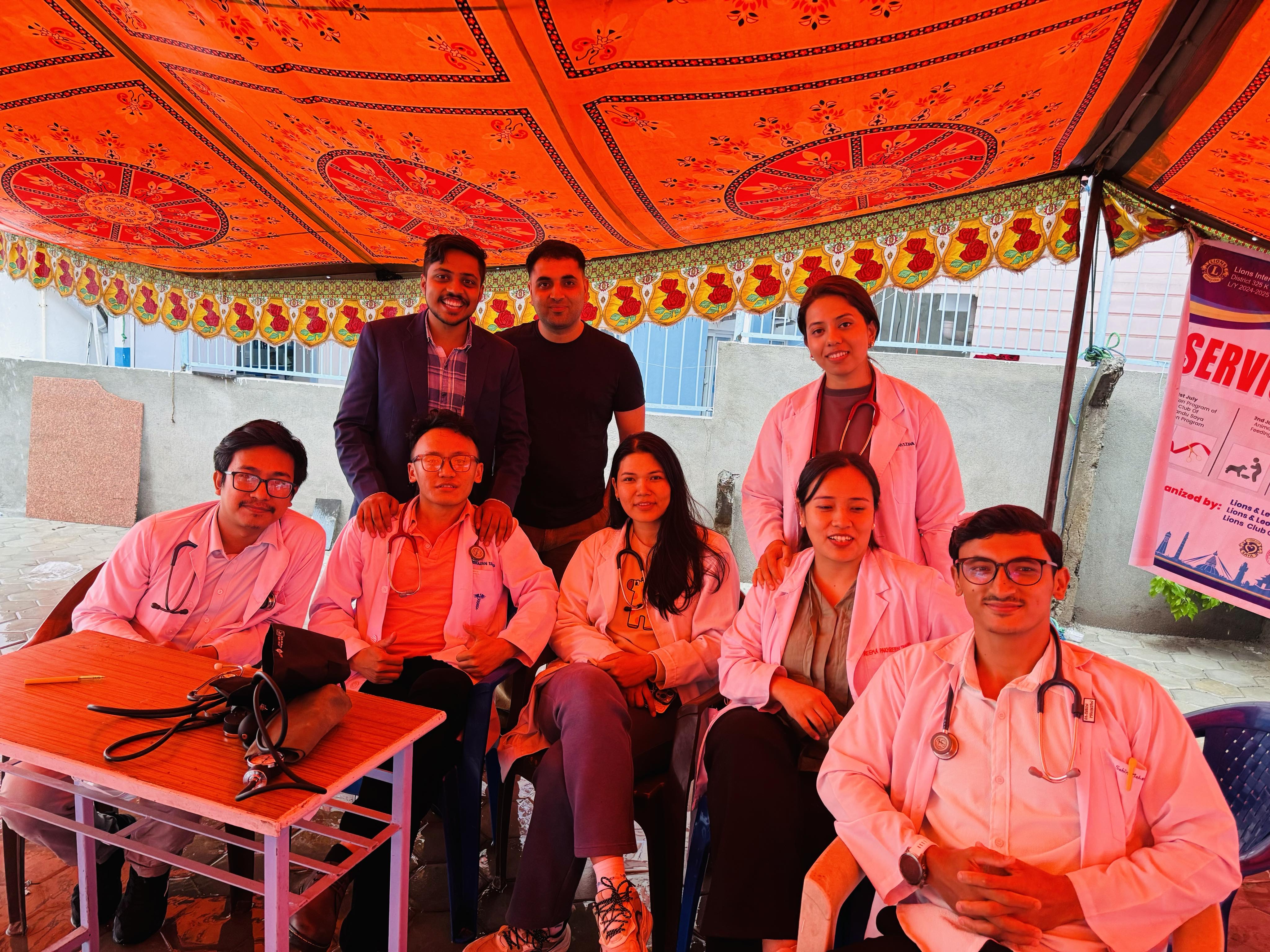 Dr. Kushal Kharel with health professionals at a community health camp