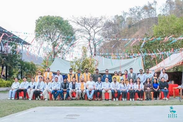 Group photo of clinicians and volunteers at a Lions Club of Kathmandu Saya mega health camp and blood donation programme at Sandy Beach Resort